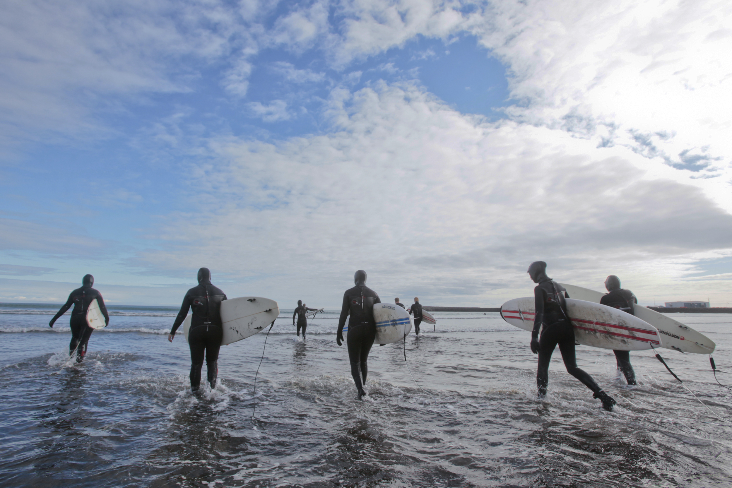 Friends Surf Iceland’s Waters